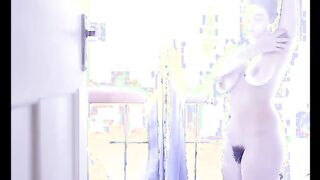 young hairy beauty washes hairy pussy in the sunlight